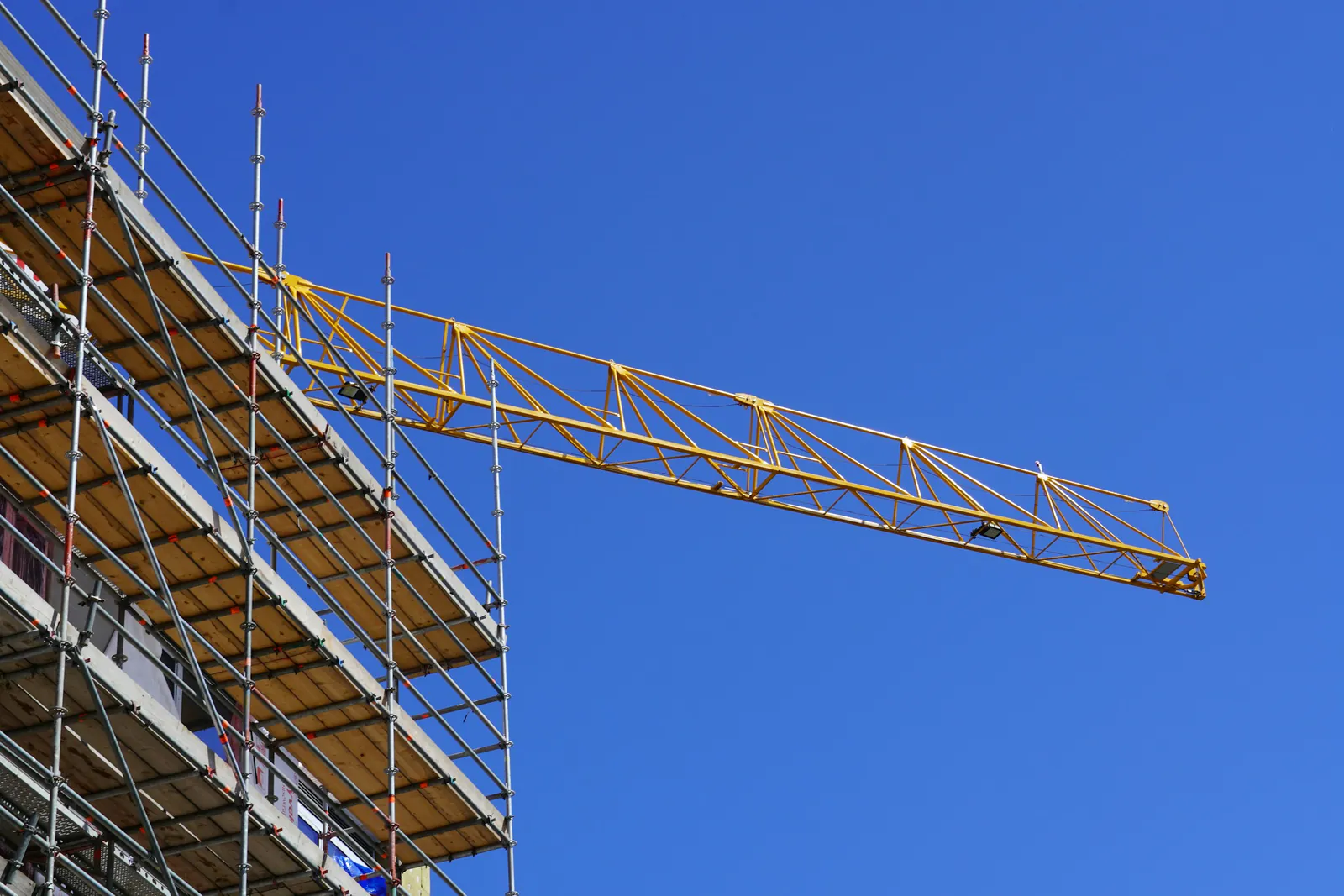 Tower crane over a building under construction