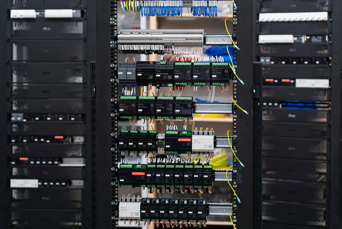 Open electrical control panel with breakers and wiring